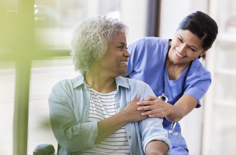 Hypothetical Amgen® Nurse Partner Helping a Patient